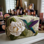 Cosmetiquera acolchada con estampado pradera de colibríes